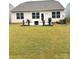 A well maintained backyard patio area with ample yard space at 110 White Apple Way, Statesville, NC 28625