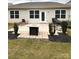 Outdoor patio area has a fire pit, room for grilling, and a small grassy area at 110 White Apple Way, Statesville, NC 28625