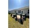 Inviting backyard with a grill, a patio, manicured shrubs, and lush green lawn space at 110 White Apple Way, Statesville, NC 28625