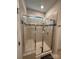Tiled shower with seamless glass door and bench for easy access at 110 White Apple Way, Statesville, NC 28625