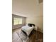 Neutral toned bedroom featuring engineered wood floors and a window with bright, natural light at 110 White Apple Way, Statesville, NC 28625