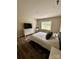 Comfortable bedroom with a neutral color palette, wood-look floors and natural lighting at 110 White Apple Way, Statesville, NC 28625