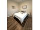 Well-lit bedroom has stylish laminate flooring, comfortable bedding, and ample space at 110 White Apple Way, Statesville, NC 28625