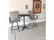 Garage with a dart board, table, and two chairs perfect for casual get-togethers and game nights at 110 White Apple Way, Statesville, NC 28625