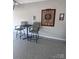 Epoxy floor in the garage featuring a table and chairs with a dartboard on the wall at 110 White Apple Way, Statesville, NC 28625