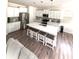 Open concept kitchen and living room with a large island and modern appliances at 110 White Apple Way, Statesville, NC 28625