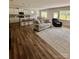 Open-concept living room that flows to kitchen, offering lots of natural light, and comfortable seating creating a relaxed space at 110 White Apple Way, Statesville, NC 28625