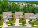 Aerial view of a suburban neighborhood showcasing well-maintained homes and tree-lined streets at 11070 River Oaks Nw Dr, Concord, NC 28027