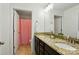 Bathroom featuring dual sinks with granite countertops and neutral tile flooring at 11070 River Oaks Nw Dr, Concord, NC 28027