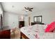 Bright bedroom featuring a ceiling fan, large closets, and natural light at 11070 River Oaks Nw Dr, Concord, NC 28027