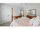 Cozy bedroom featuring matching nightstands and a four-poster bed with white and peach bedding at 11070 River Oaks Nw Dr, Concord, NC 28027