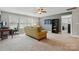 Spacious bonus room featuring a desk, comfortable seating and neutral carpet and paint colors at 11070 River Oaks Nw Dr, Concord, NC 28027