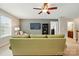 Bright bonus room showcasing comfortable seating, a television and doorway that leads to an en-suite bathroom at 11070 River Oaks Nw Dr, Concord, NC 28027