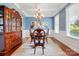 Formal dining room with coffered ceilings, elegant chandelier, and traditional furniture at 11070 River Oaks Nw Dr, Concord, NC 28027