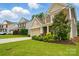 Lovely two-story house boasting lush greenery, a well-kept lawn, and a charming front facade at 11070 River Oaks Nw Dr, Concord, NC 28027