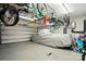 Spacious garage featuring ample storage space, ceiling racks for bikes, and covered car at 11070 River Oaks Nw Dr, Concord, NC 28027