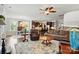 Spacious living room with hardwood floors, fireplace, and view to the kitchen and dining area at 11070 River Oaks Nw Dr, Concord, NC 28027