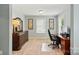 Bright, dedicated office space featuring a large desk, dresser, and natural light at 11070 River Oaks Nw Dr, Concord, NC 28027