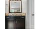A close-up of a bathroom vanity with granite countertops at 11070 River Oaks Nw Dr, Concord, NC 28027