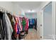 Spacious walk-in closet with ample storage and clothing racks at 11070 River Oaks Nw Dr, Concord, NC 28027