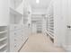 A well-organized walk-in closet featuring built-in shelves and drawers for ample storage at 1108 Shinnecock Ln, Waxhaw, NC 28173