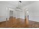 Spacious dining area featuring hardwood floors, decorative columns, and modern lighting at 1108 Shinnecock Ln, Waxhaw, NC 28173