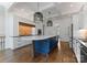 Modern kitchen with a spacious island, stainless steel appliances, and designer touches at 1108 Shinnecock Ln, Waxhaw, NC 28173
