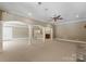 Open living area featuring support columns, recessed lighting, and a bar at 1108 Shinnecock Ln, Waxhaw, NC 28173
