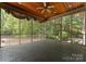 Large screened-in porch with stained wood ceiling and tile flooring; ideal for outdoor living at 1108 Shinnecock Ln, Waxhaw, NC 28173