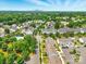 Aerial view showcases a residential community with lush greenery, a pool, and convenient parking at 1134 Plaza Walk Dr, Charlotte, NC 28215