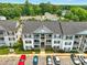 Three story condominium building with a rear parking lot at 1134 Plaza Walk Dr, Charlotte, NC 28215