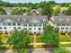 Well-maintained townhouse with charming curb appeal and lush green landscaping at 1134 Plaza Walk Dr, Charlotte, NC 28215