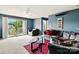 Cozy living room with neutral carpet, comfortable sofa, glass table, and outdoor balcony access at 1134 Plaza Walk Dr, Charlotte, NC 28215