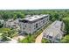 Aerial view of the property surrounded by lush greenery and neighboring houses at 1172 Queens Rd, Charlotte, NC 28207