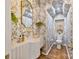 Chic powder room with ornate wallpaper and stylish fixtures at 1172 Queens Rd, Charlotte, NC 28207