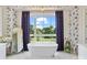 A luxurious bathroom featuring a modern freestanding tub, stylish decor, and abundant natural light at 1172 Queens Rd, Charlotte, NC 28207
