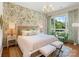 Bright bedroom featuring floral wallpaper, hardwood floors, large window and contemporary furnishings at 1172 Queens Rd, Charlotte, NC 28207