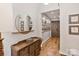 Hallway entry area featuring wood floors and a decorative shelf at 1172 Queens Rd, Charlotte, NC 28207