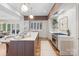 Gourmet kitchen includes a marble island, wine rack, stainless steel appliances, and custom cabinetry at 1172 Queens Rd, Charlotte, NC 28207