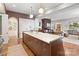 Gourmet kitchen includes an expansive island, stainless steel appliances, and modern fixtures at 1172 Queens Rd, Charlotte, NC 28207