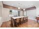 A spacious kitchen showcases an oversized island, modern lighting, and stainless steel appliances at 1172 Queens Rd, Charlotte, NC 28207
