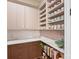 Kitchen pantry with mug collection, countertop, drawers, and shelving for ample storage space at 1172 Queens Rd, Charlotte, NC 28207