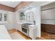 Modern kitchen featuring marble countertops, stainless steel appliances, and custom storage solutions at 1172 Queens Rd, Charlotte, NC 28207