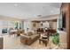 Sunlit open living space with a dining area and smooth transition to kitchen at 1172 Queens Rd, Charlotte, NC 28207