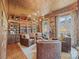 Elegant living room with custom shelving, wood paneling, and leather furniture at 1172 Queens Rd, Charlotte, NC 28207
