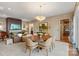Spacious living area showcasing a dining space and seamless flow to the bar area at 1172 Queens Rd, Charlotte, NC 28207