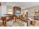 Inviting living room with a fireplace, piano, and stylish decor at 1172 Queens Rd, Charlotte, NC 28207