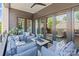 Enjoy outdoor living on this covered patio with comfortable seating and a glimpse of the interior at 1172 Queens Rd, Charlotte, NC 28207