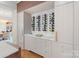 This luxurious home boasts a custom wine bar with a marble countertop and ample storage at 1172 Queens Rd, Charlotte, NC 28207