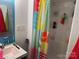 Bathroom with a shower, sink and colorful curtain at 120 Starboard Trl, Mount Gilead, NC 27306